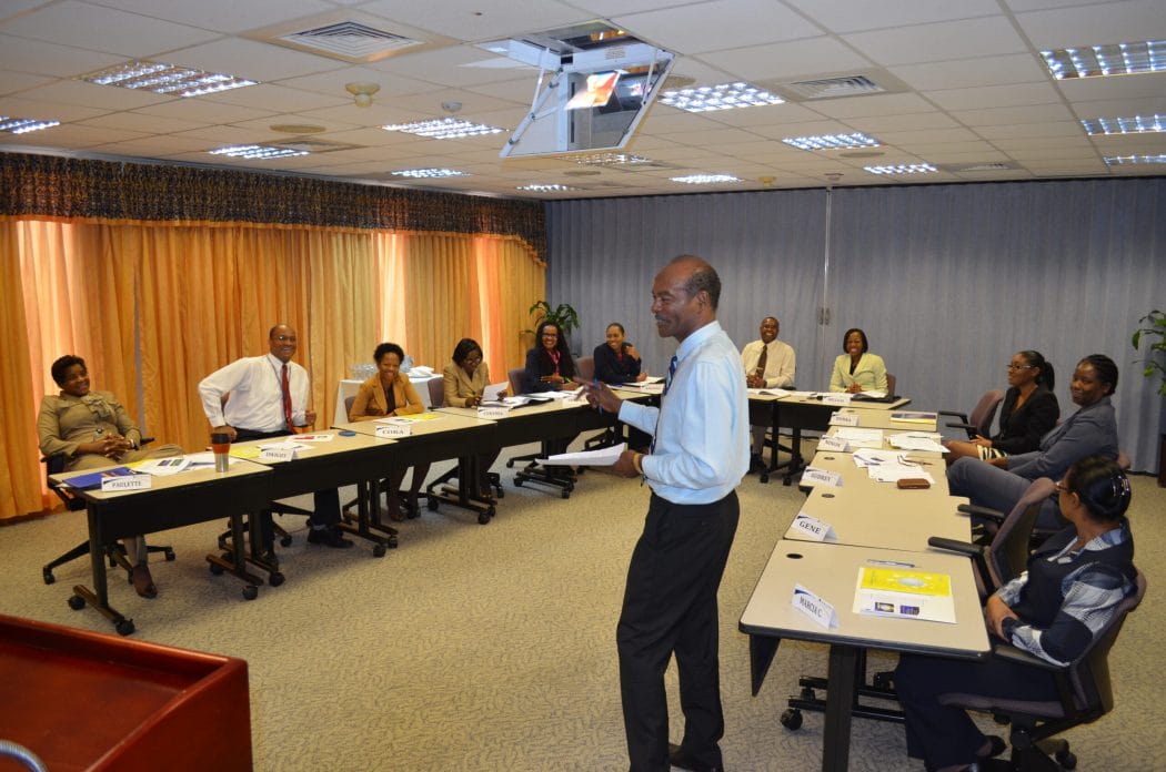 Mr. A. W. Tony Griffiths addresses a captive audience on how to coach for organisational success.